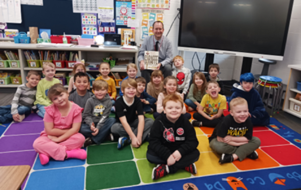 Mr. Roper with students in classroom