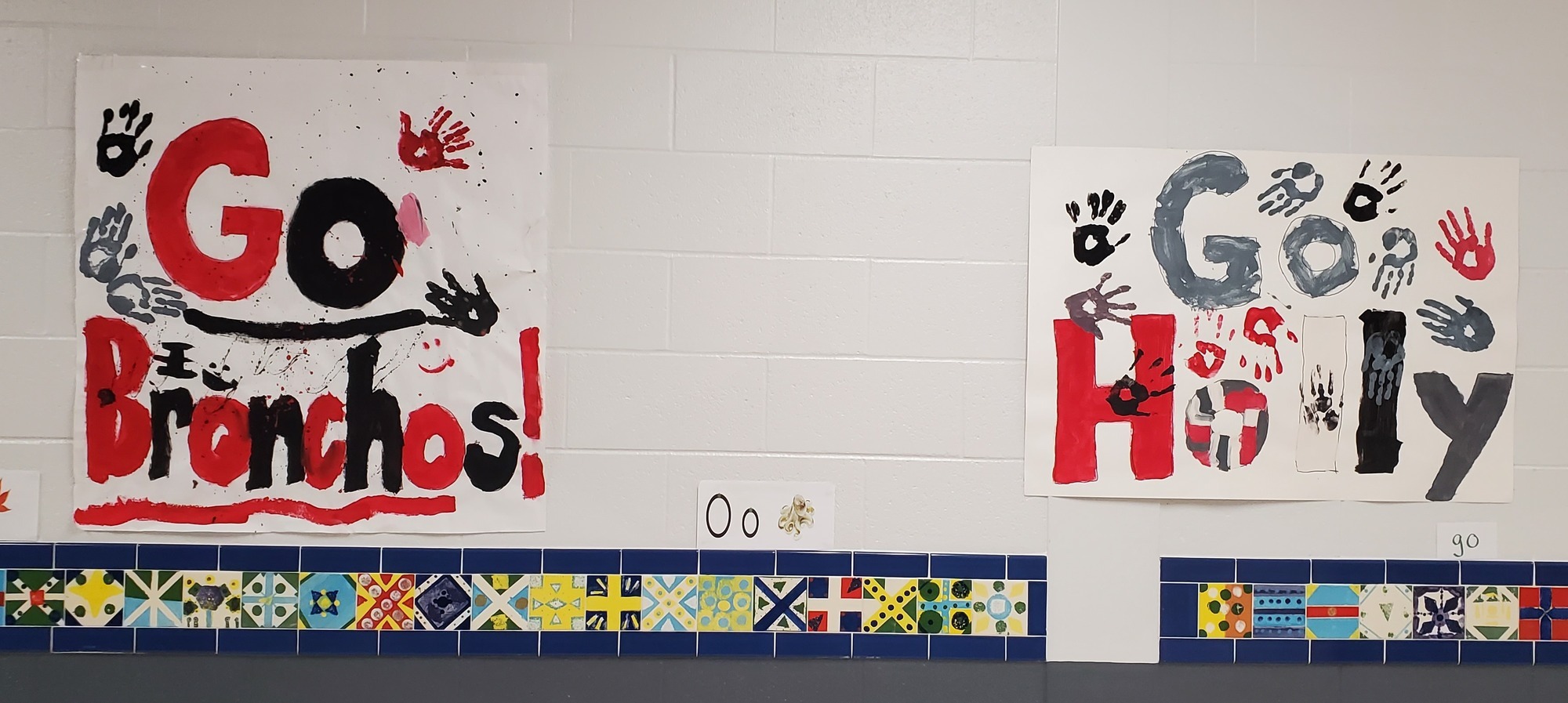 Two signs that say 'Go Bronchos'