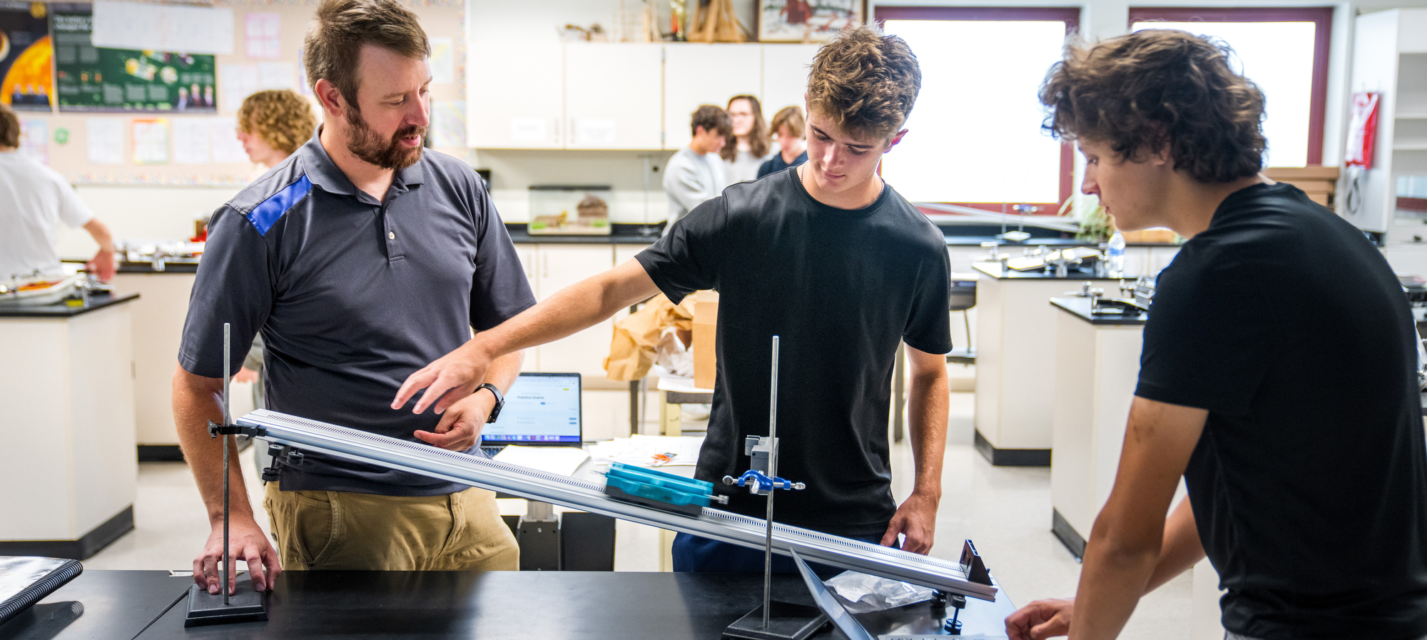 Students with teacher in science lab