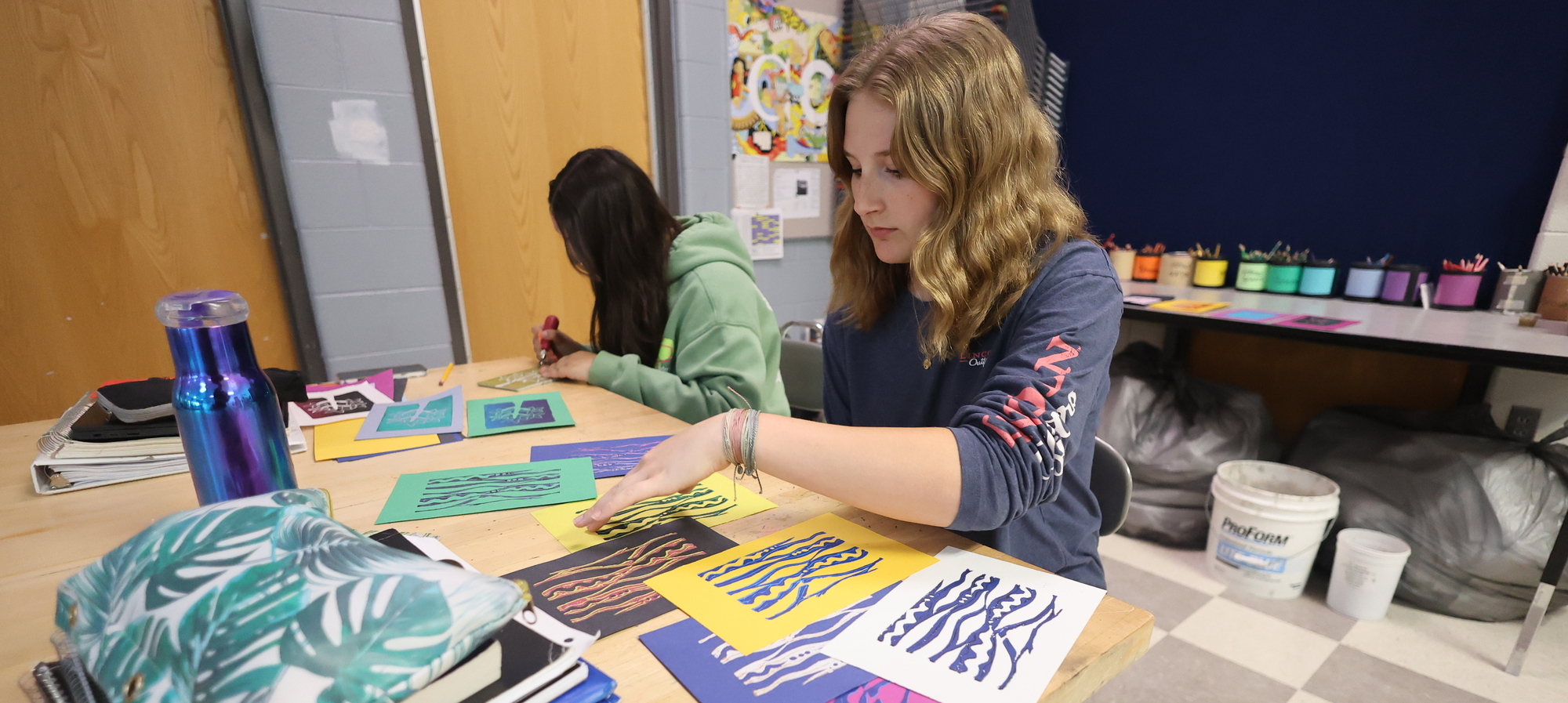Student with art project