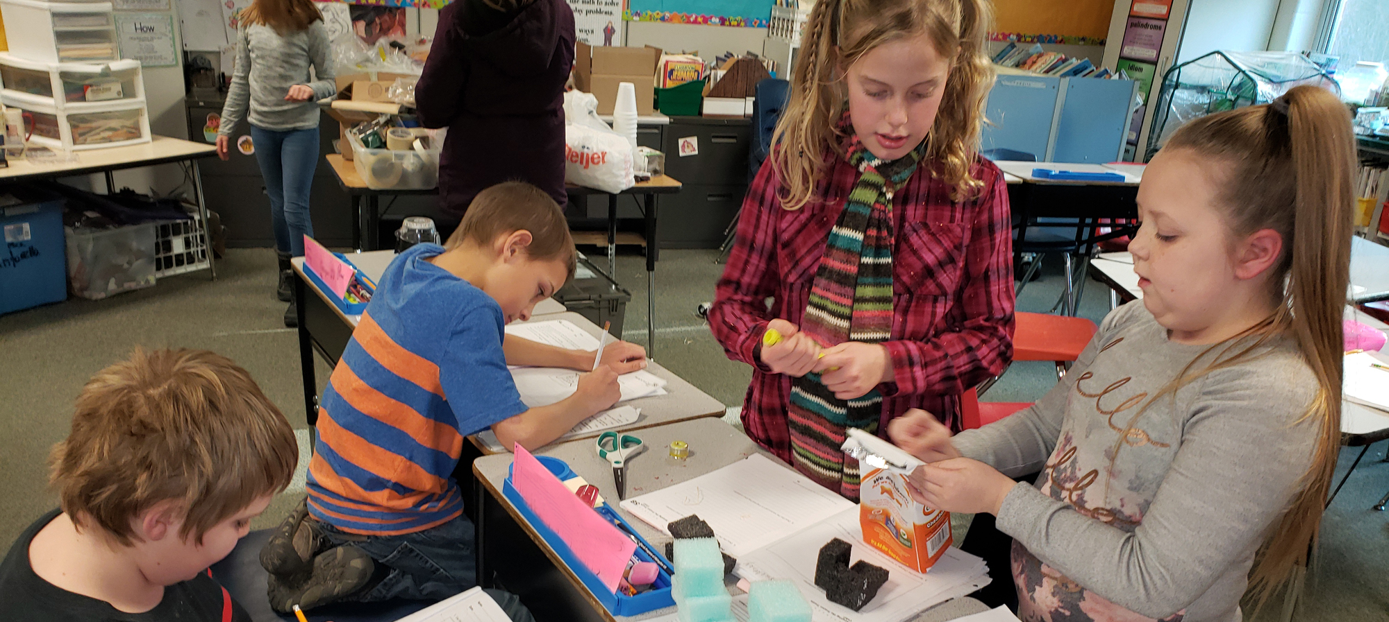 Students working in classroom on a project