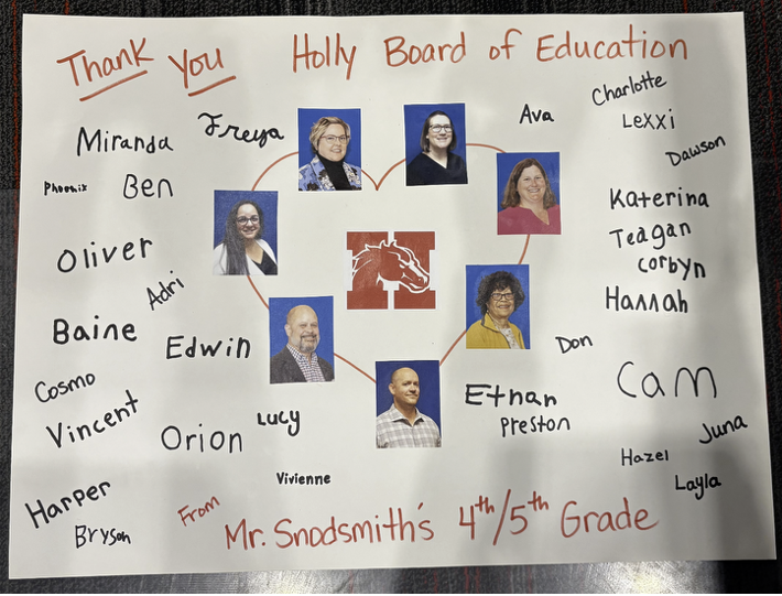 Banner with Thank you Holly Board of Education and pictures of the board members. From Mr. Snodsmith’s 4th and 5th Grade class. Students signed the banner.