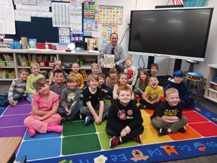 Mr Roper in classroom with students